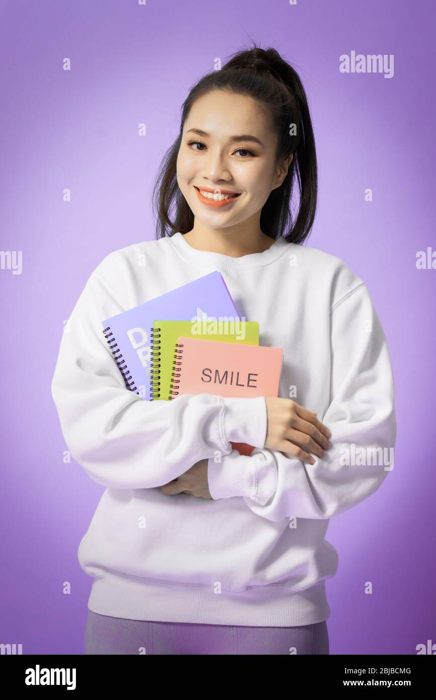 Portrait of female college student smiling at camera Stock Photo - Alamy