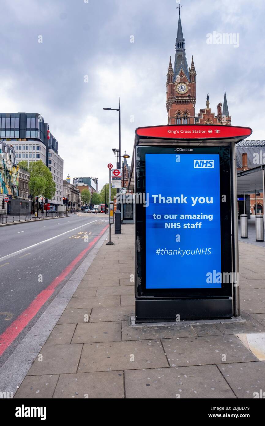 Lockdown London, April 29th 2020: Kings Cross Station, empty Euston Road, an advertising hoarding with supporting message for NHS Stock Photo