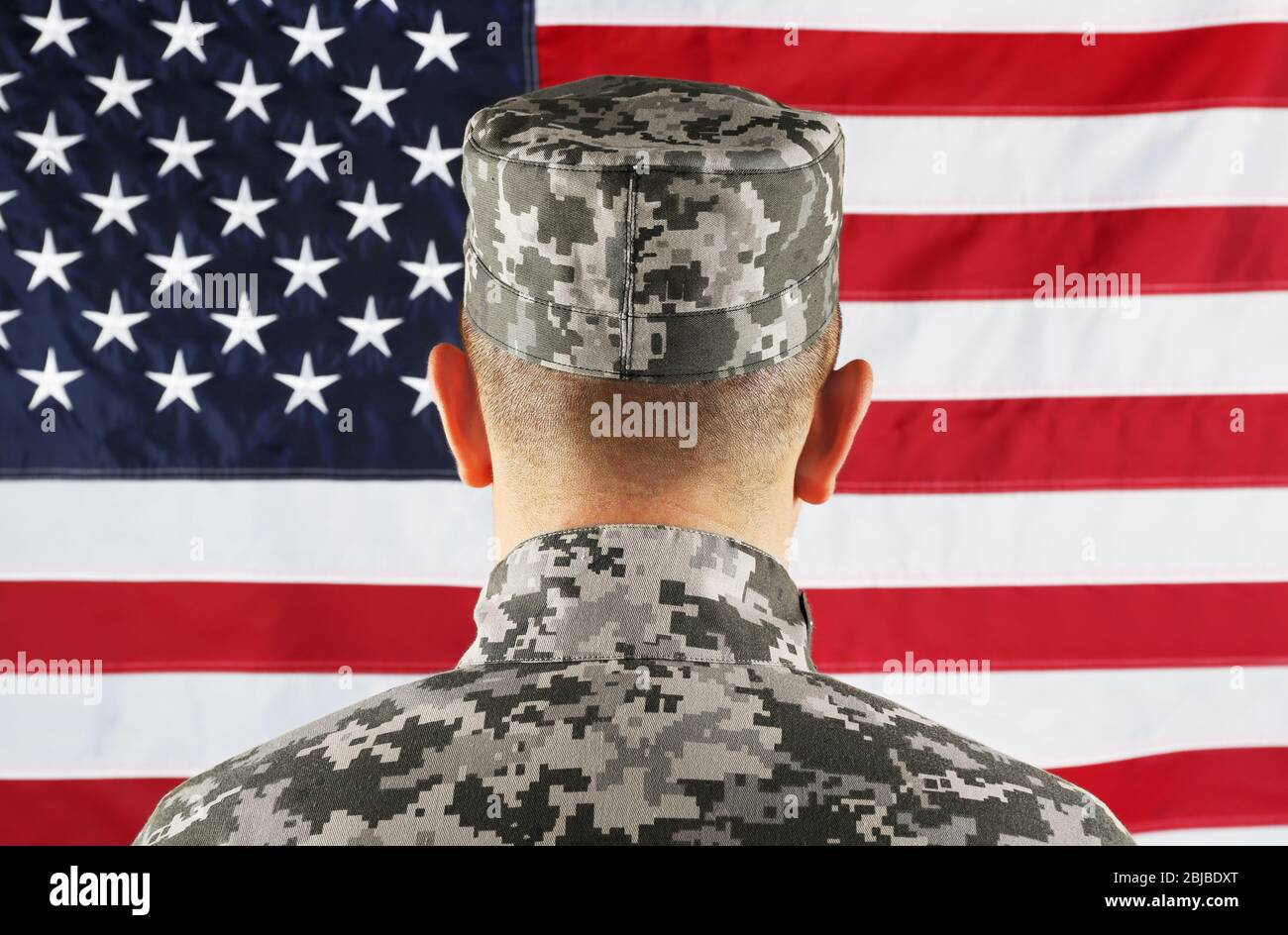 Male army soldier on American flag background Stock Photo - Alamy