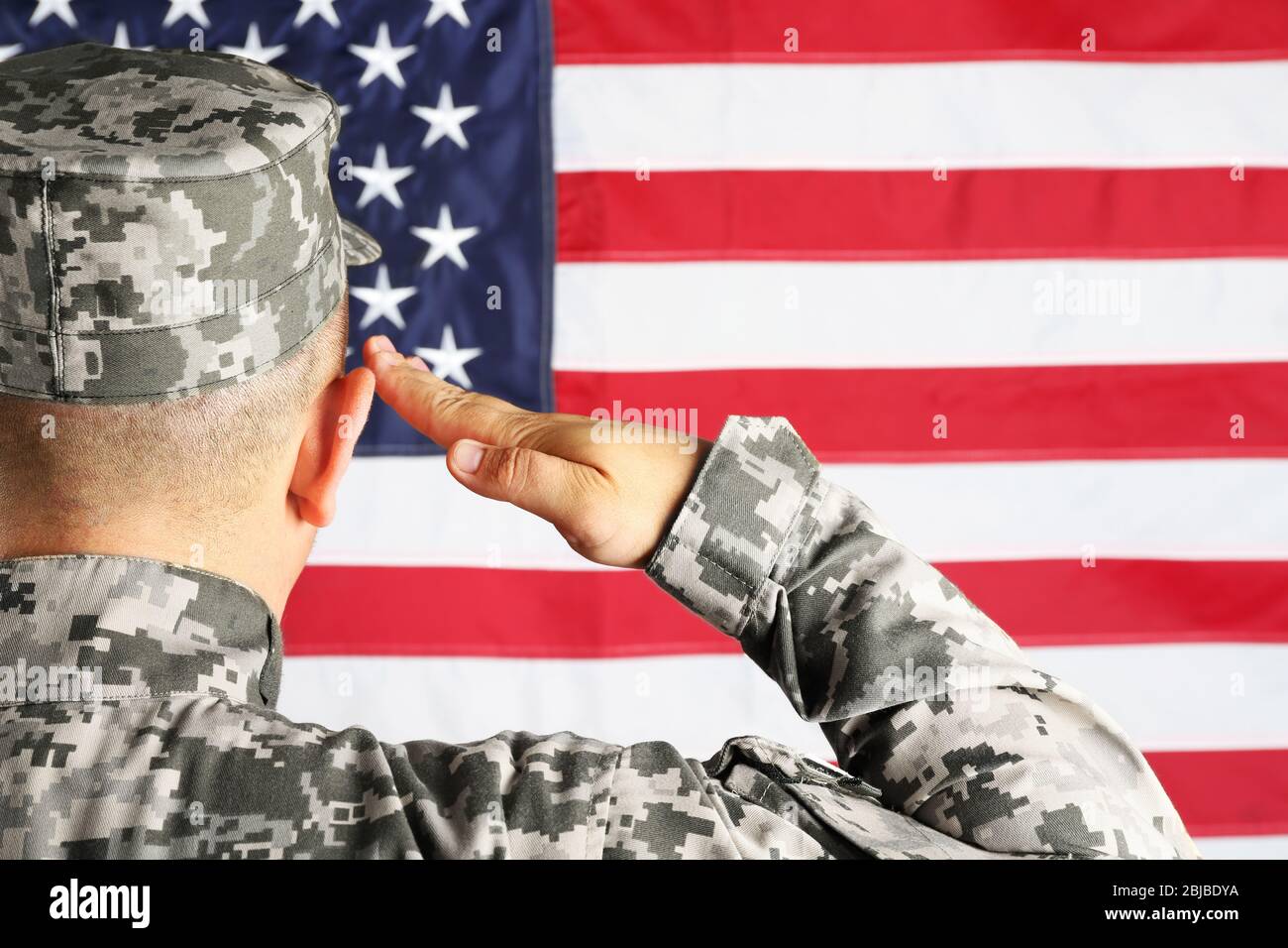 Male army soldier on American flag background Stock Photo - Alamy