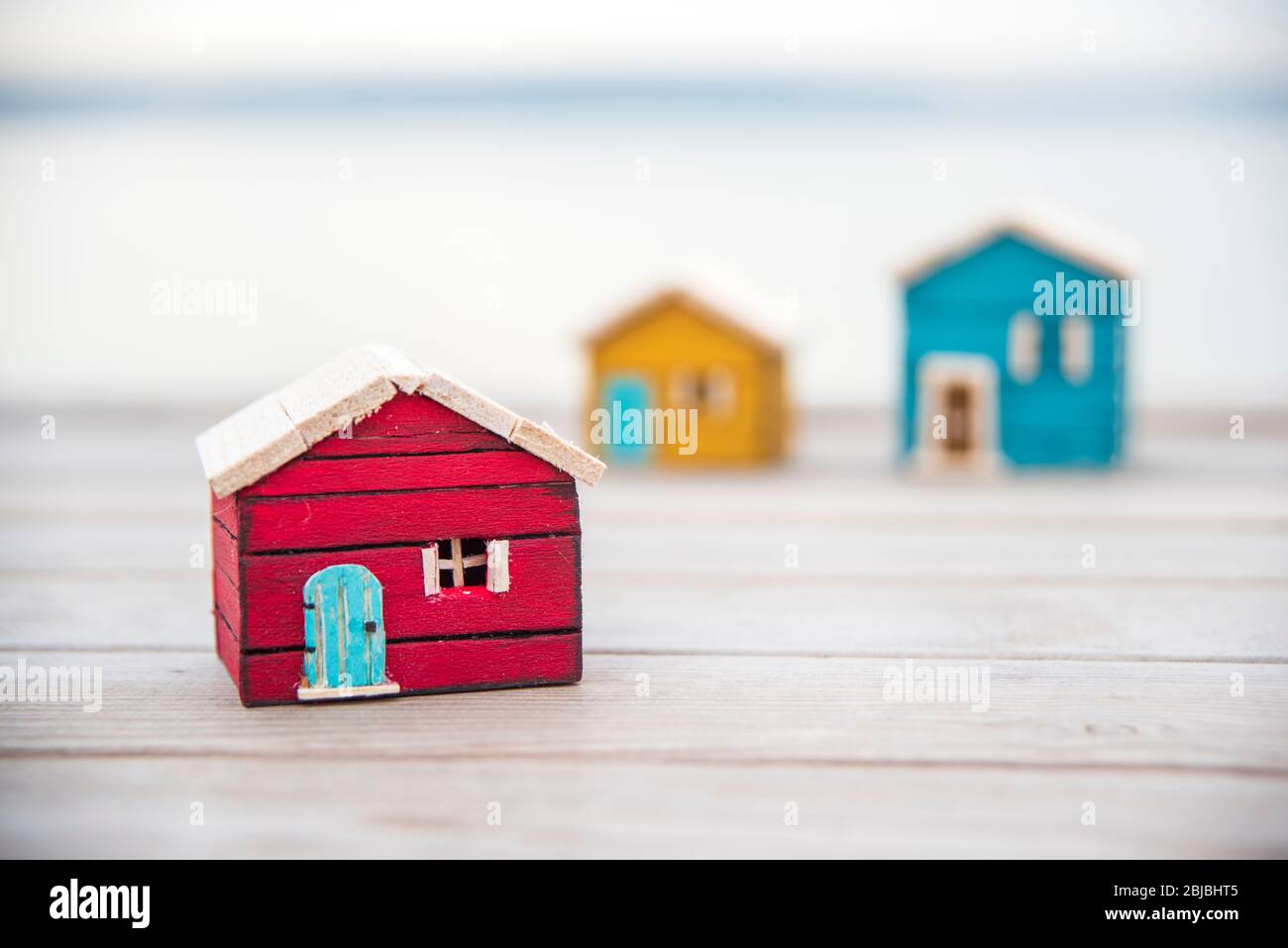 wooden model house on the beach. stay at home stay safe Stock Photo