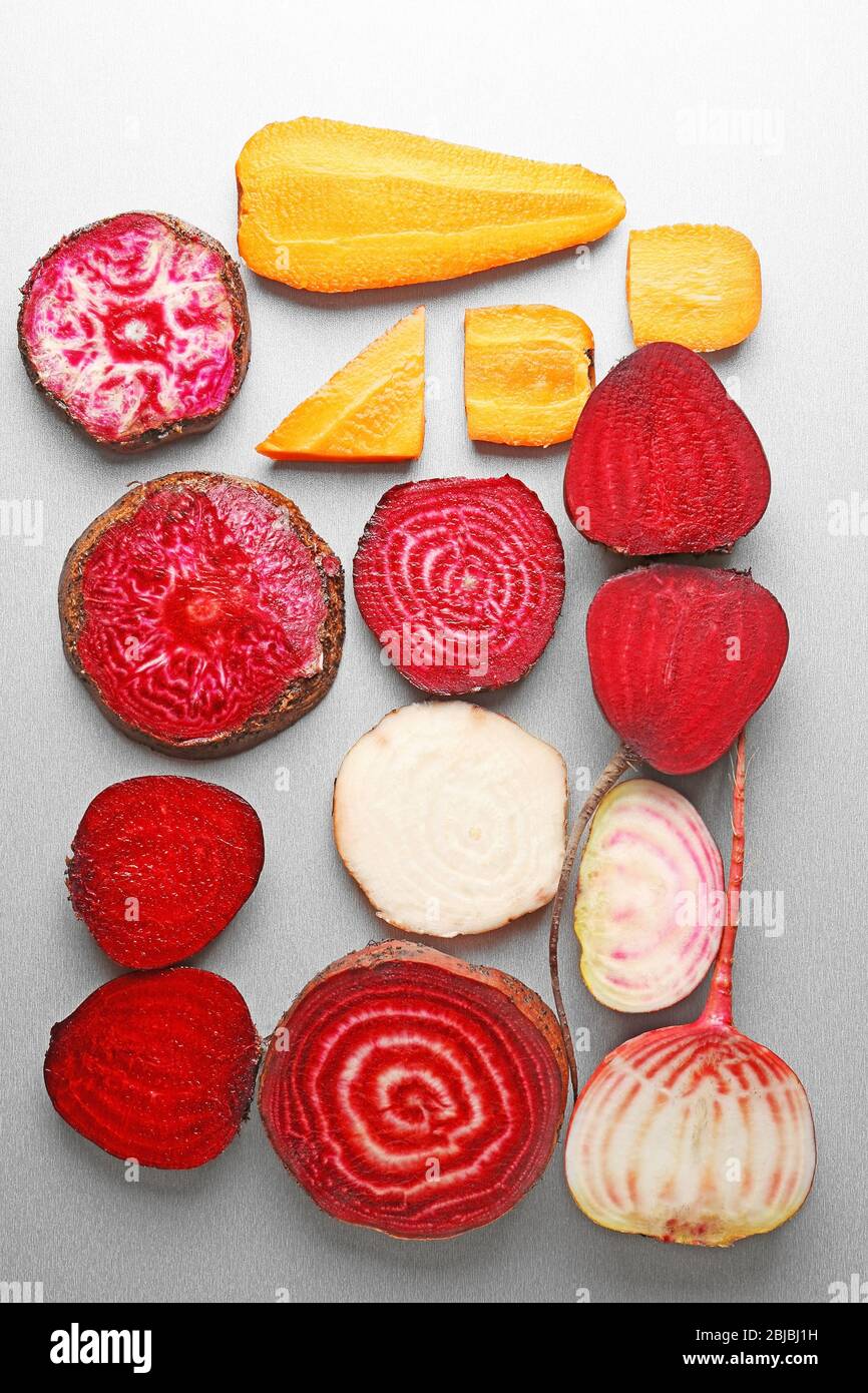 Fresh young sliced beets and carrots on grey background Stock Photo Alamy