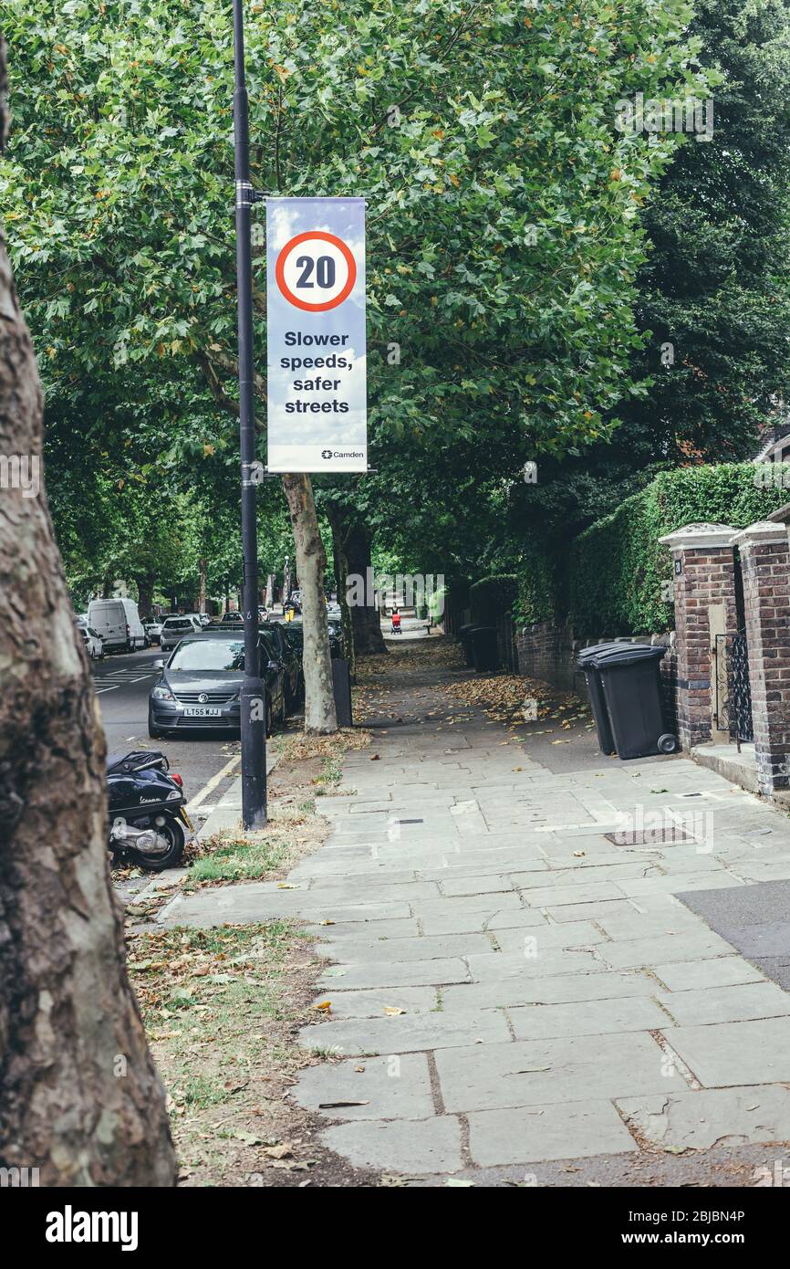 London/UK-30/7/18: Billboard on a pillar showing twenty miles per hour speed limit sign and the inscription 'Slower speeds, safer streets' on it insti Stock Photo