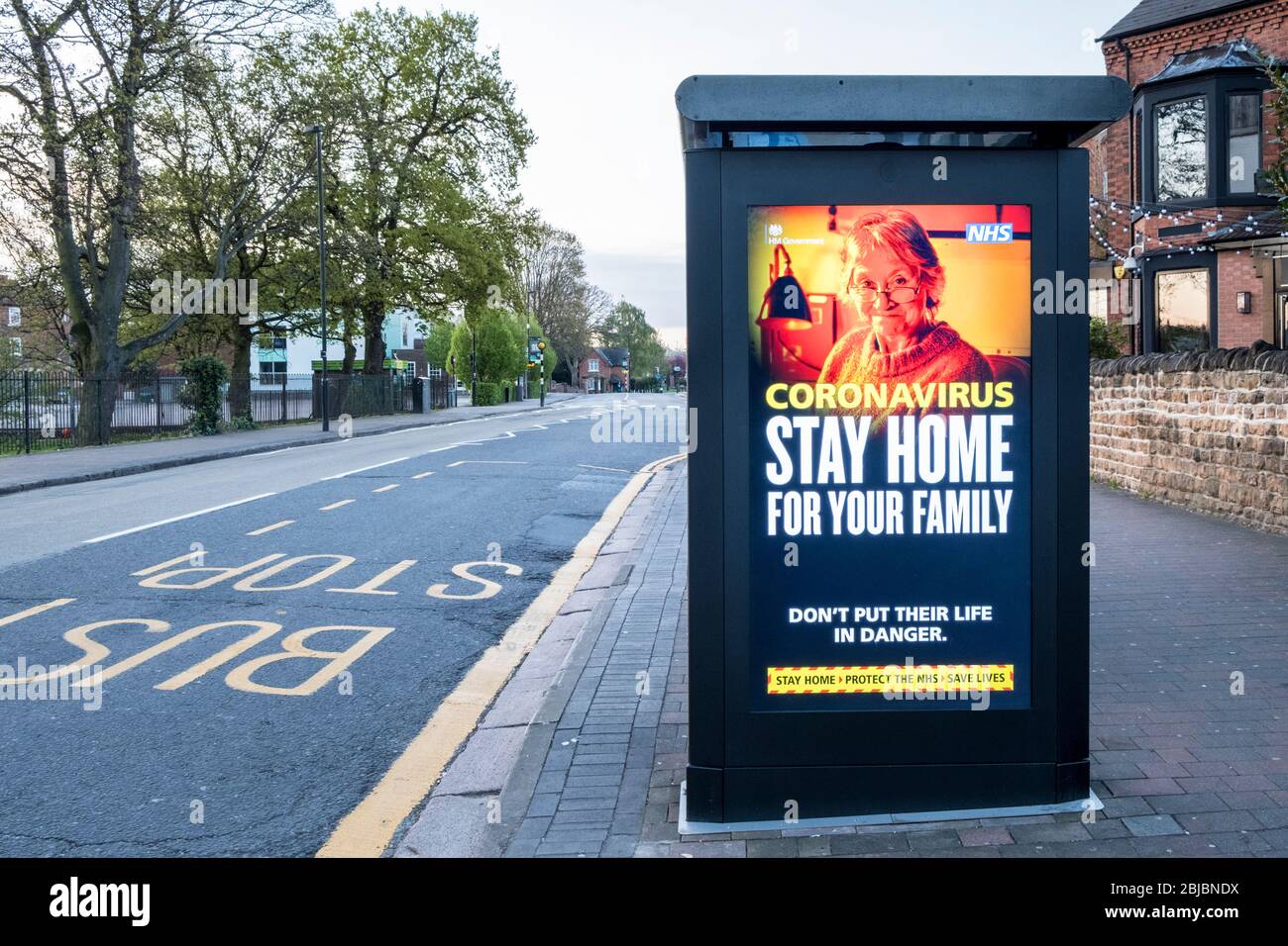 Stay home for your family message showing an older person. Covid-19 Coronavirus lockdown message on an empty street, Nottinghamshire, England, UK Stock Photo