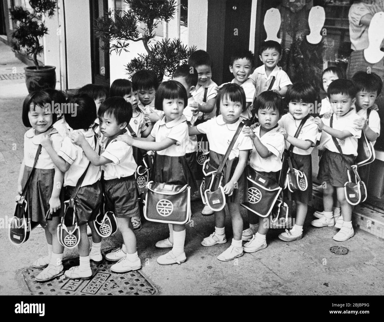 Hong Kong October 1986 Happy Valley Kindergarden School. The picture is is part of a collection of photographs taken in Hong Kong between September and November, 1986. They represent a snapshot of Daily Life in the Crown Colony eleven years before sovereignty was transferred back to mainland China. Photograph by Howard Walker / Alamy. Stock Photo
