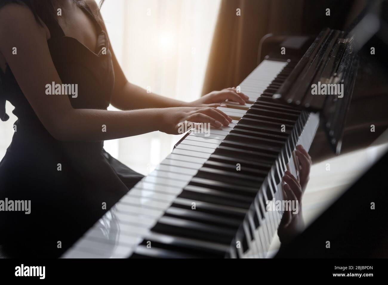 hand kids practice play piano for up skill of music ability for future occupation. Stock Photo