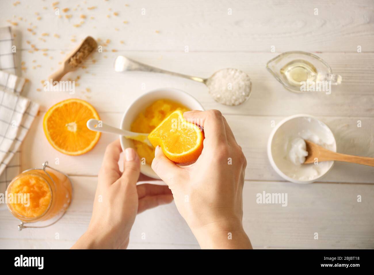 Woman body scrub orange hi-res stock photography and images - Alamy