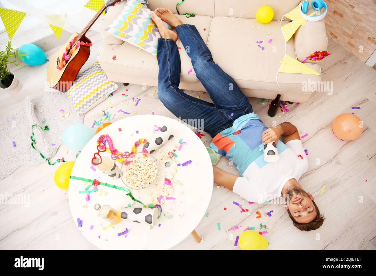Tired drunk man after party at home Stock Photo Alamy