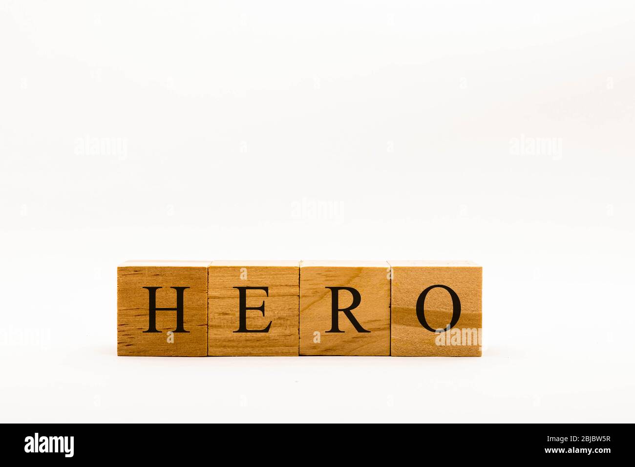 Coronavirus concept showing wooden blocks on a white background reading Hero Stock Photo