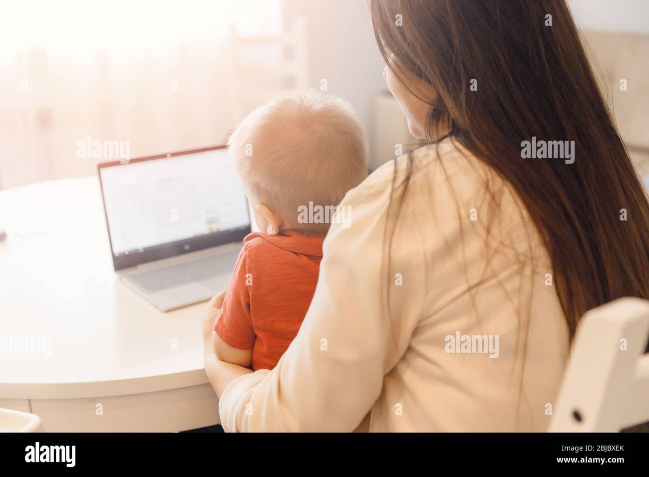 Mom and son are talking web video online chat with family. Communication quarantine people concept Stock Photo