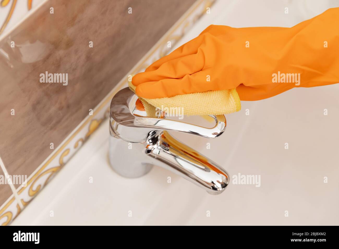 Cleaning tap from limescale bathroom sink closeup Stock Photo Alamy