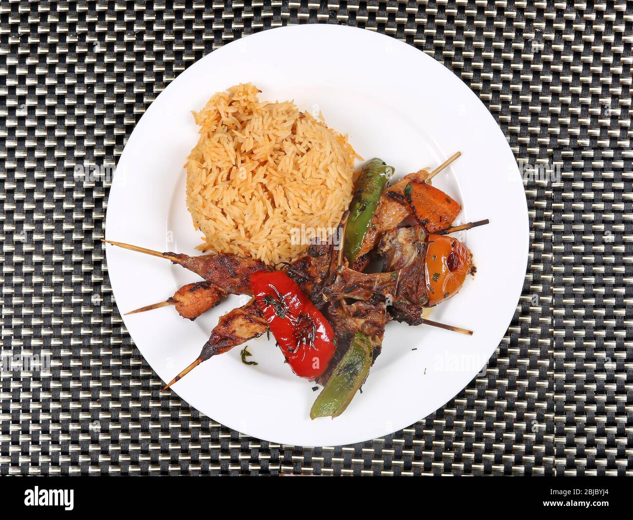 Non veg Meal | Grilled Mutton Chaps, Kebab, Grilled Tomato and Capsicum served with Rice Stock Photo