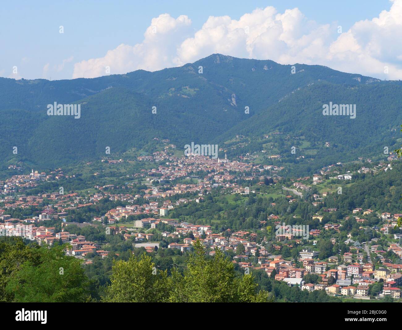 Beautiful aerial view of Bergamo Italy in summer with town trees and mountains Stock Photo