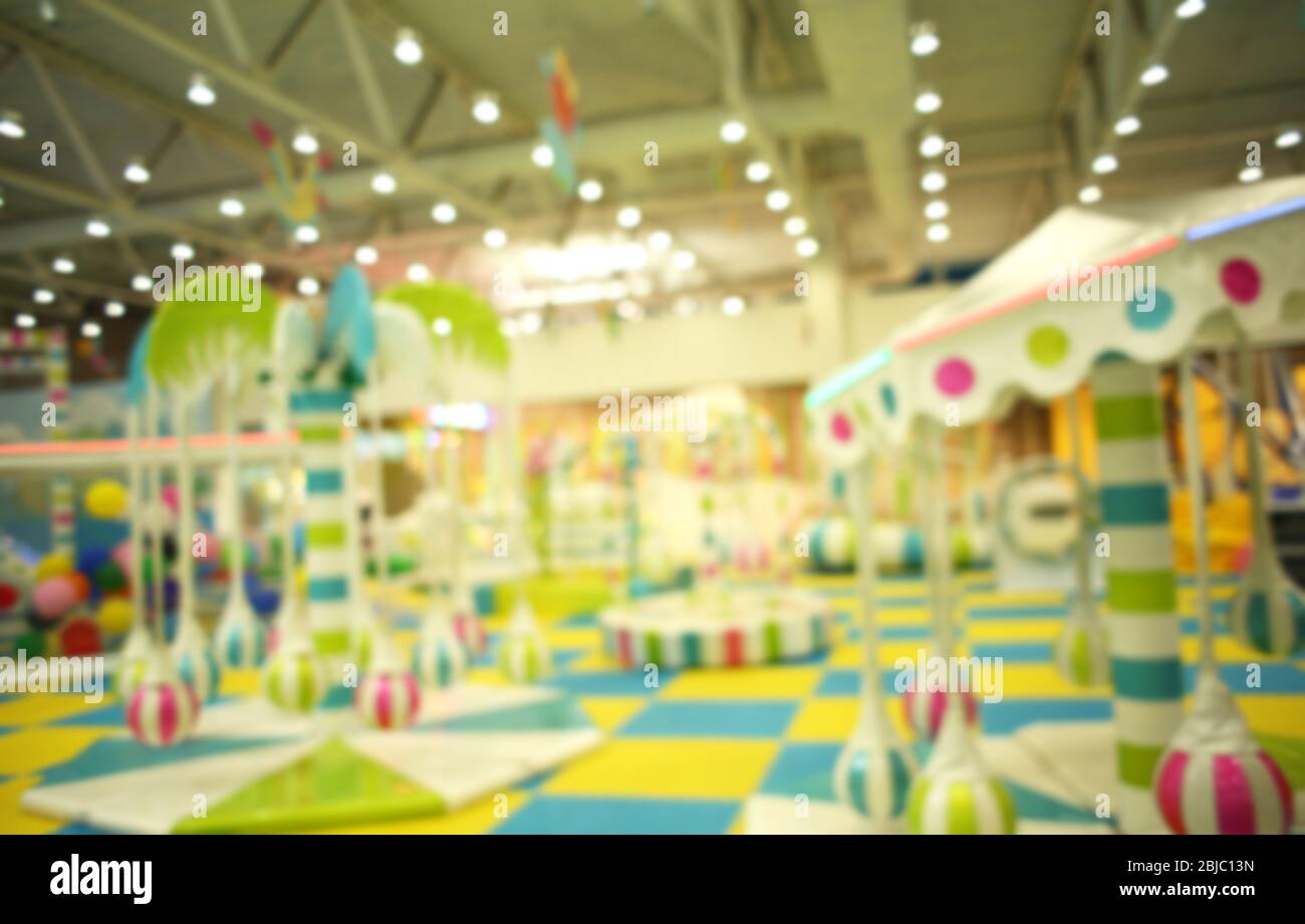Game zone in shopping mall, blurred background Stock Photo - Alamy