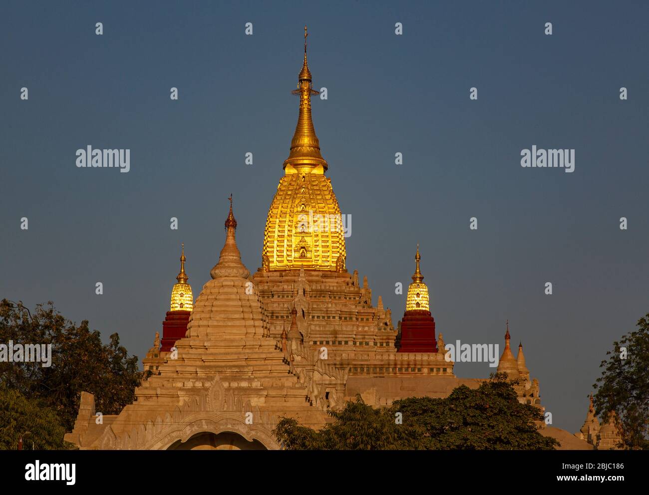 Upper part of Ananda temple in bright sunlight in the beginning of the evening, Bagan, Myanmar Stock Photo