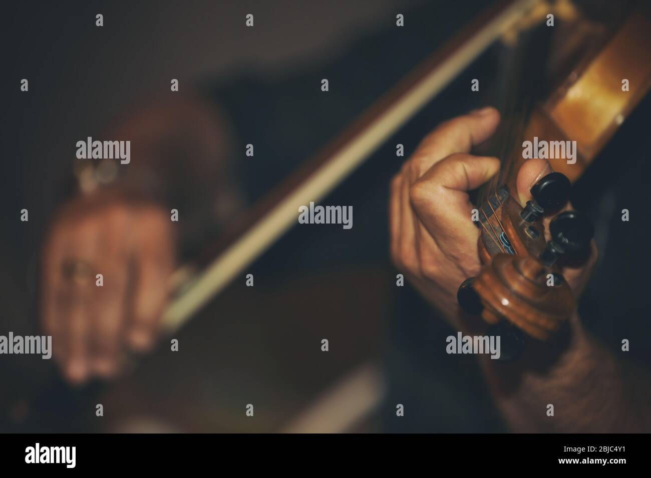 Man playing violin at wedding Stock Photo