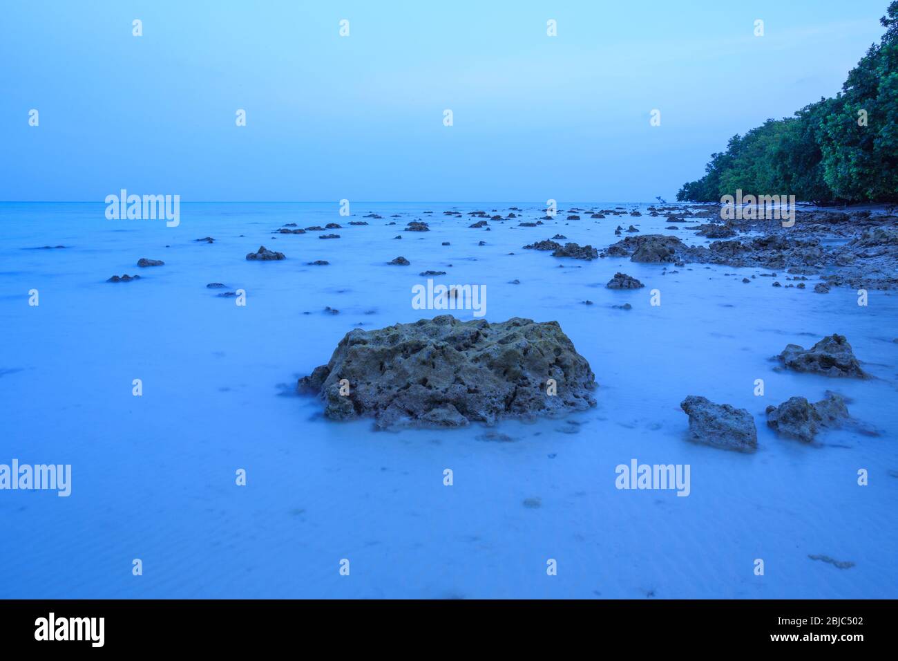 Beautiful rocky sea beach sunset hi-res stock photography and images ...