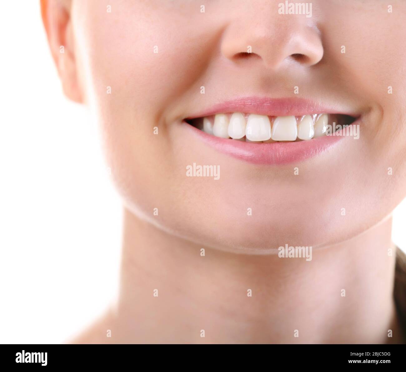 Young woman smiling on white background Stock Photo - Alamy