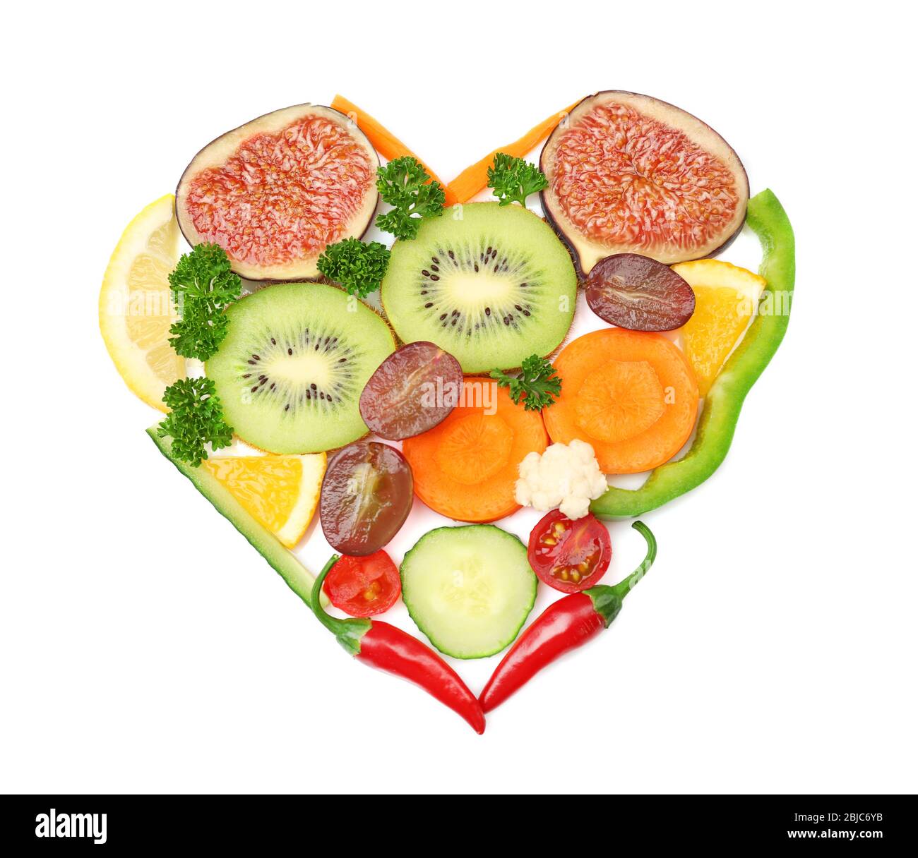 Heart of fruits and vegetables isolated on white Stock Photo - Alamy