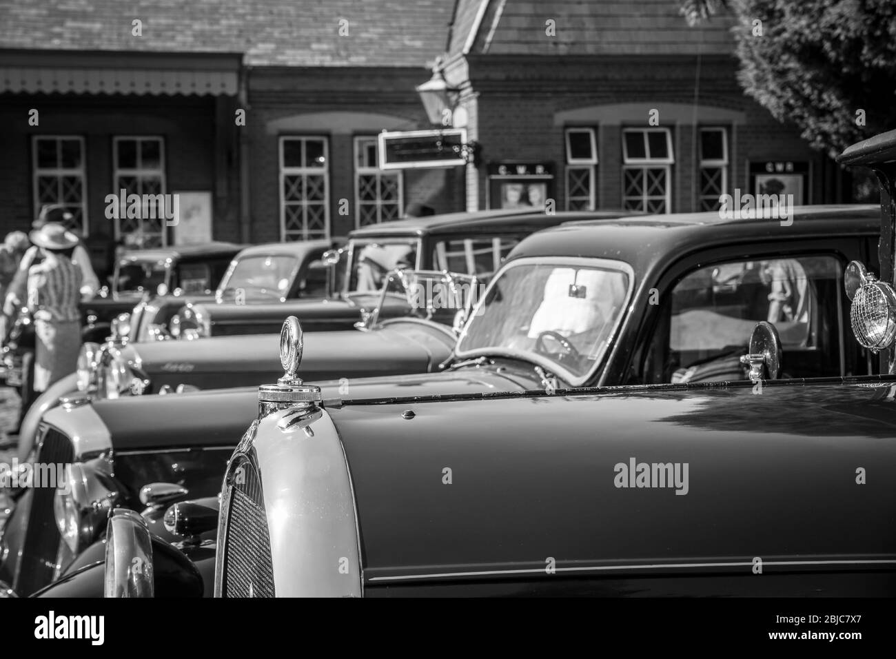 Monochrome close up of 1940s vintage classic motor cars parked in