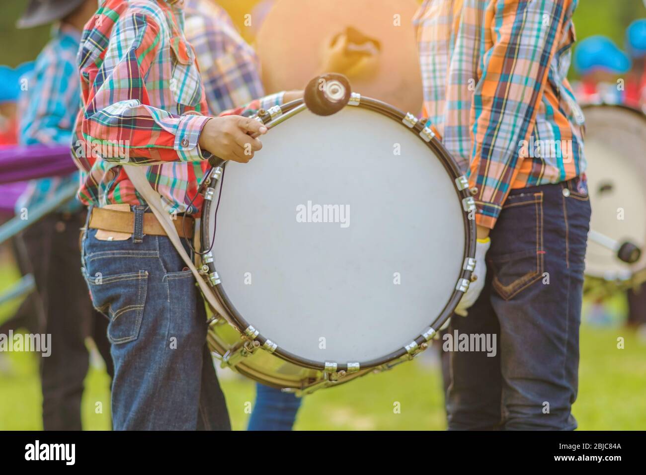 Marching band bass drummers perform in school parade Stock Photo Alamy