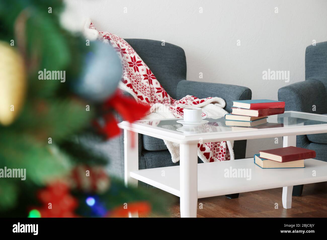 Table and two armchairs in living room Stock Photo Alamy