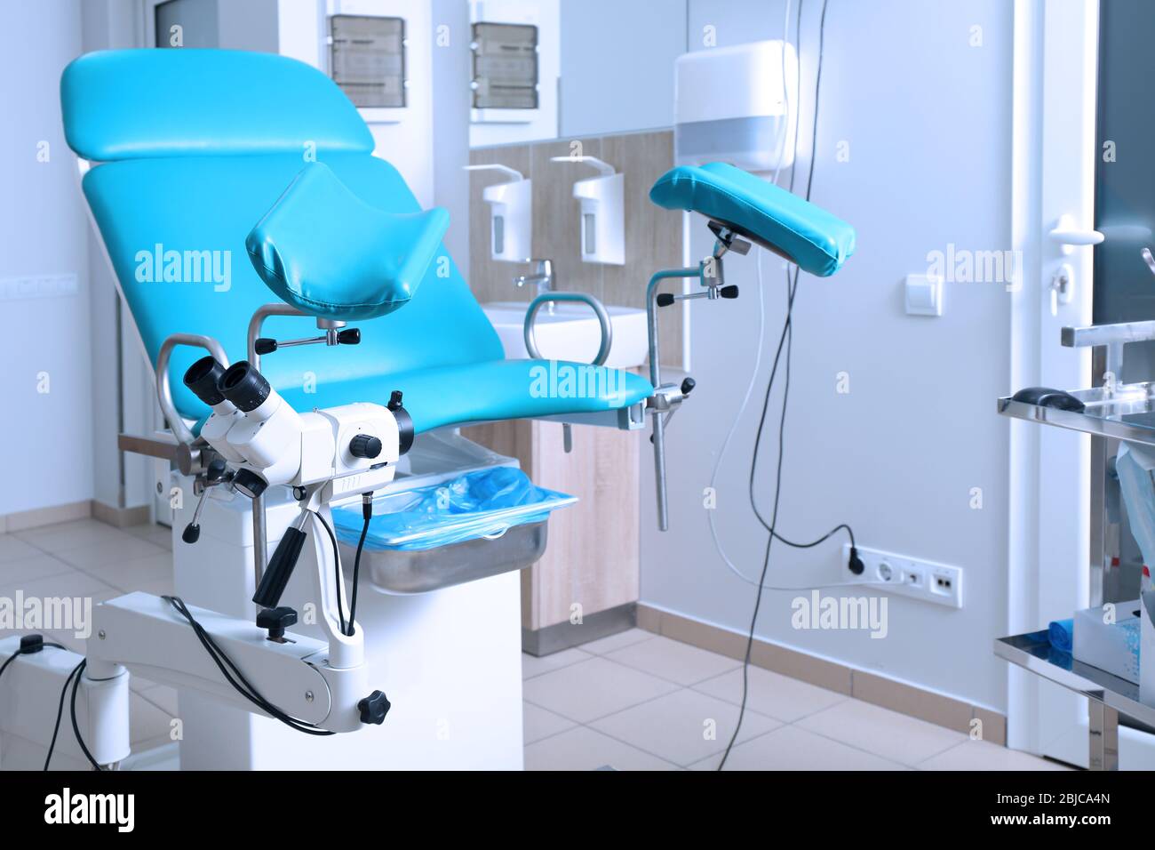 Gynecological room with chair and equipment Stock Photo - Alamy