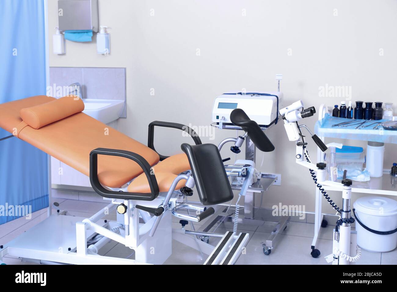 Gynecological room with chair and equipment Stock Photo - Alamy