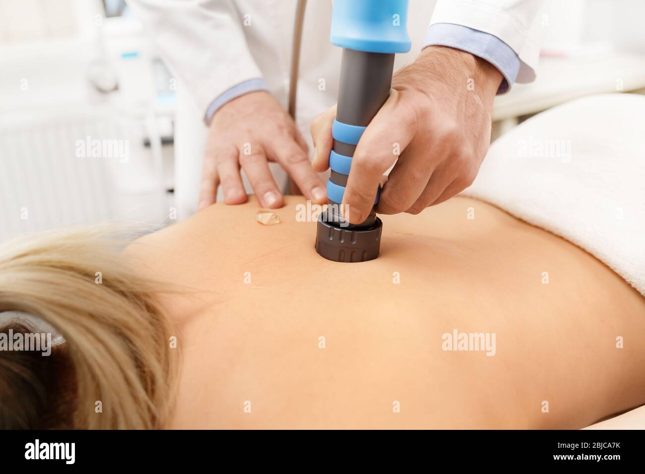 https://c8.alamy.com/comp/2BJCA7K/extracorporeal-shockwave-therapy-eswtnon-surgical-treatmentphysical-therapy-for-neck-and-back-musclesspine-with-shock-wavespain-relief-2BJCA7K.jpg