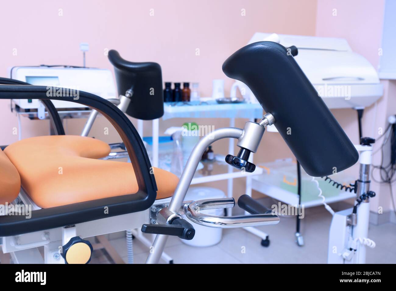 Gynecological room with chair and equipment Stock Photo - Alamy