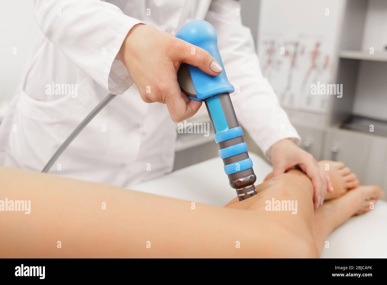 Extracorporeal Shockwave Therapy ESWT.Effective non-surgical  treatment.Physical therapy for lower back with shock waves.Pain relief,  normalization and Stock Photo - Alamy