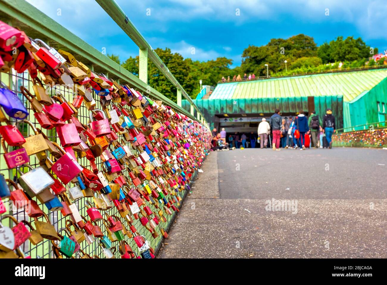 Love locks on the bridge to the Landungsbrücken metro station, Hamburg, Germany Stock Photo