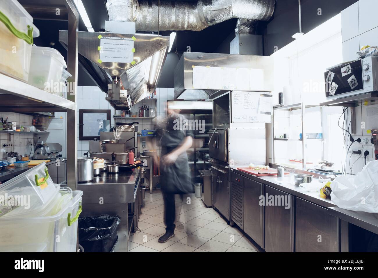 Behind the scenes of brands. The chef cooking in a professional kitchen