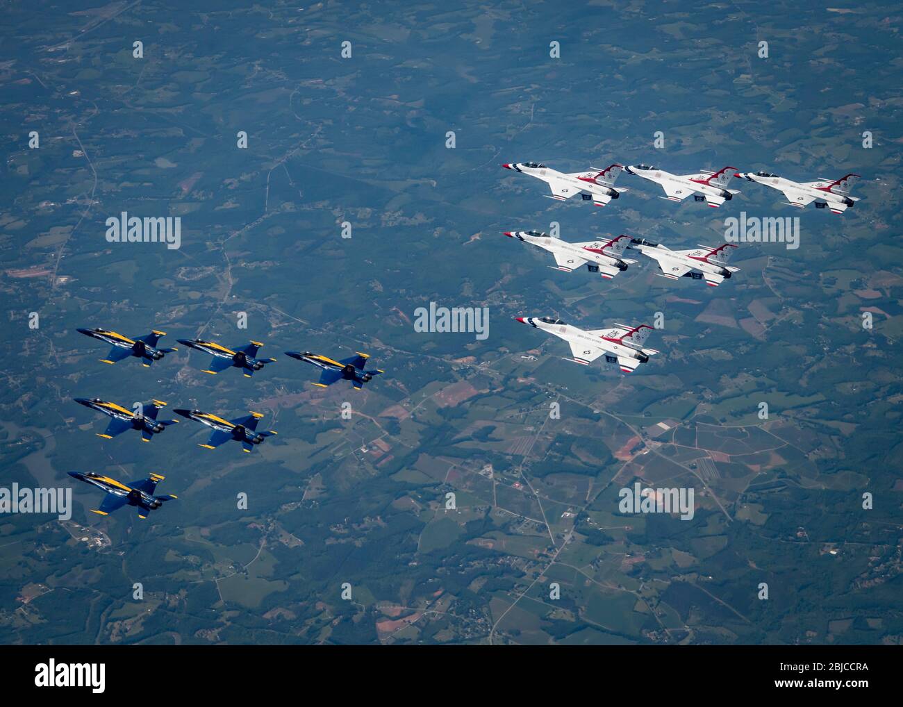 Philadelphia, United States. 28th Apr, 2020. The U.S. Air Force Air Demonstration Squadron, the Thunderbirds, lower, and the Navy Demonstration Squadron, the Blue Angels, top, fly over parts of New Jersey during the America Strong flyover April 28, 2020 near Philadelphia, Pennsylvania. America Strong is a salute from the Navy and Air Force to recognize healthcare workers, first responders, and other essential personnel in a show of national solidarity during the COVID-19 pandemic. Credit: Cory Bush/U.S. Air Force/Alamy Live News Stock Photo