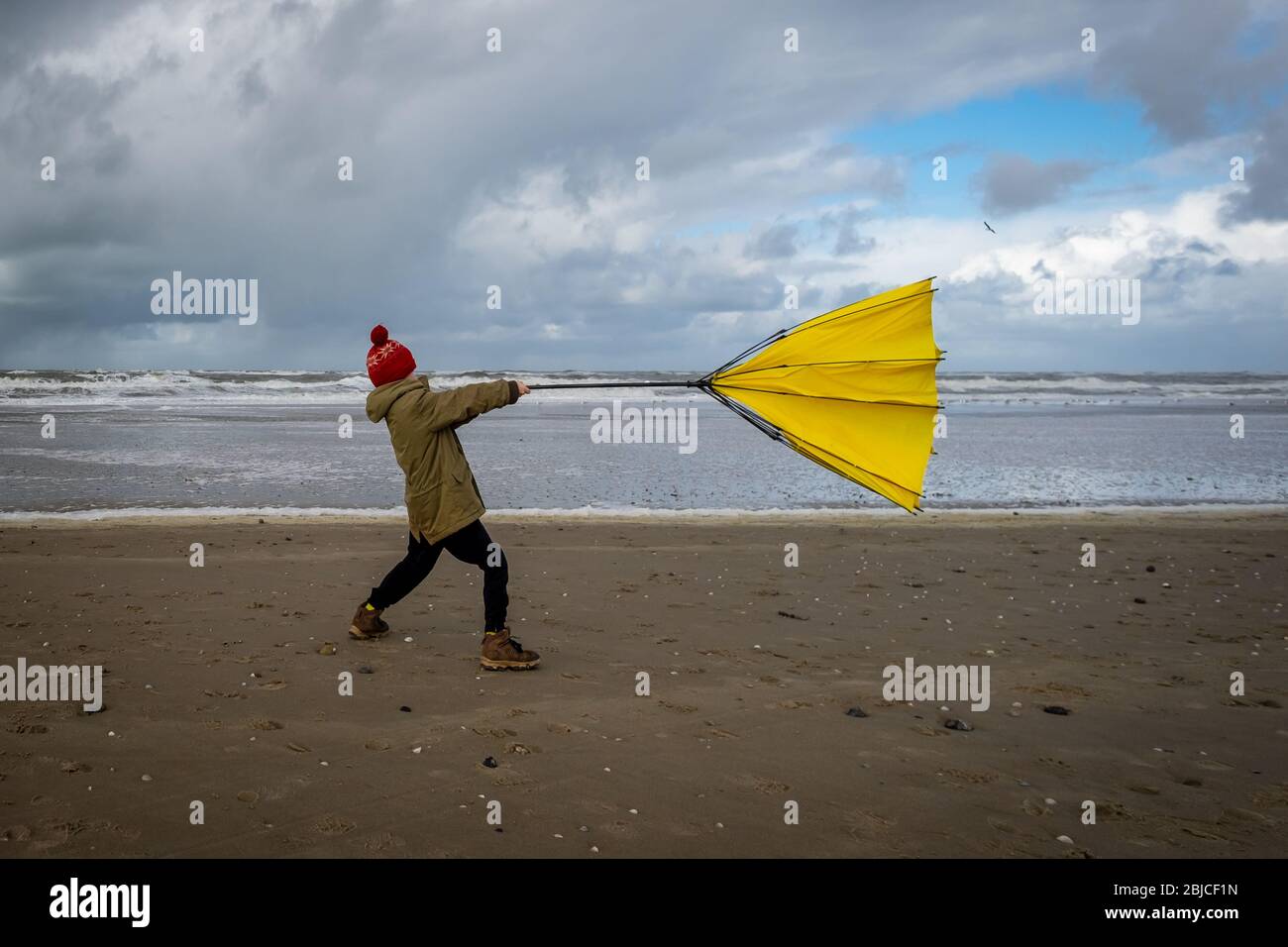 Struggling with wind hi-res stock photography and images - Alamy