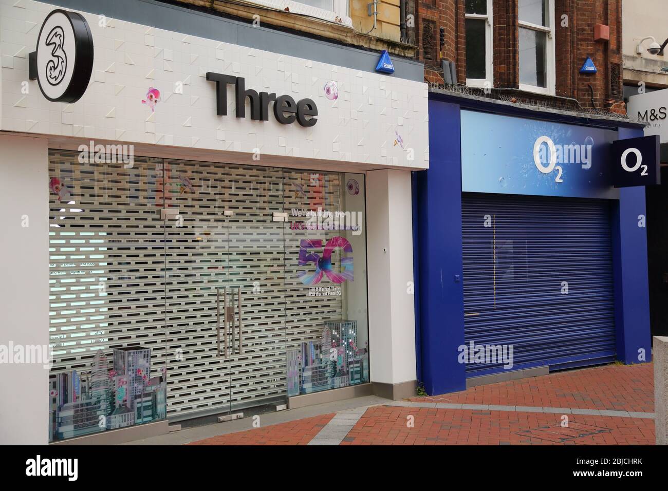 Retail outlets for the telecommunications companies 3 and O2 in Broad Street, Reading, UK Stock Photo
