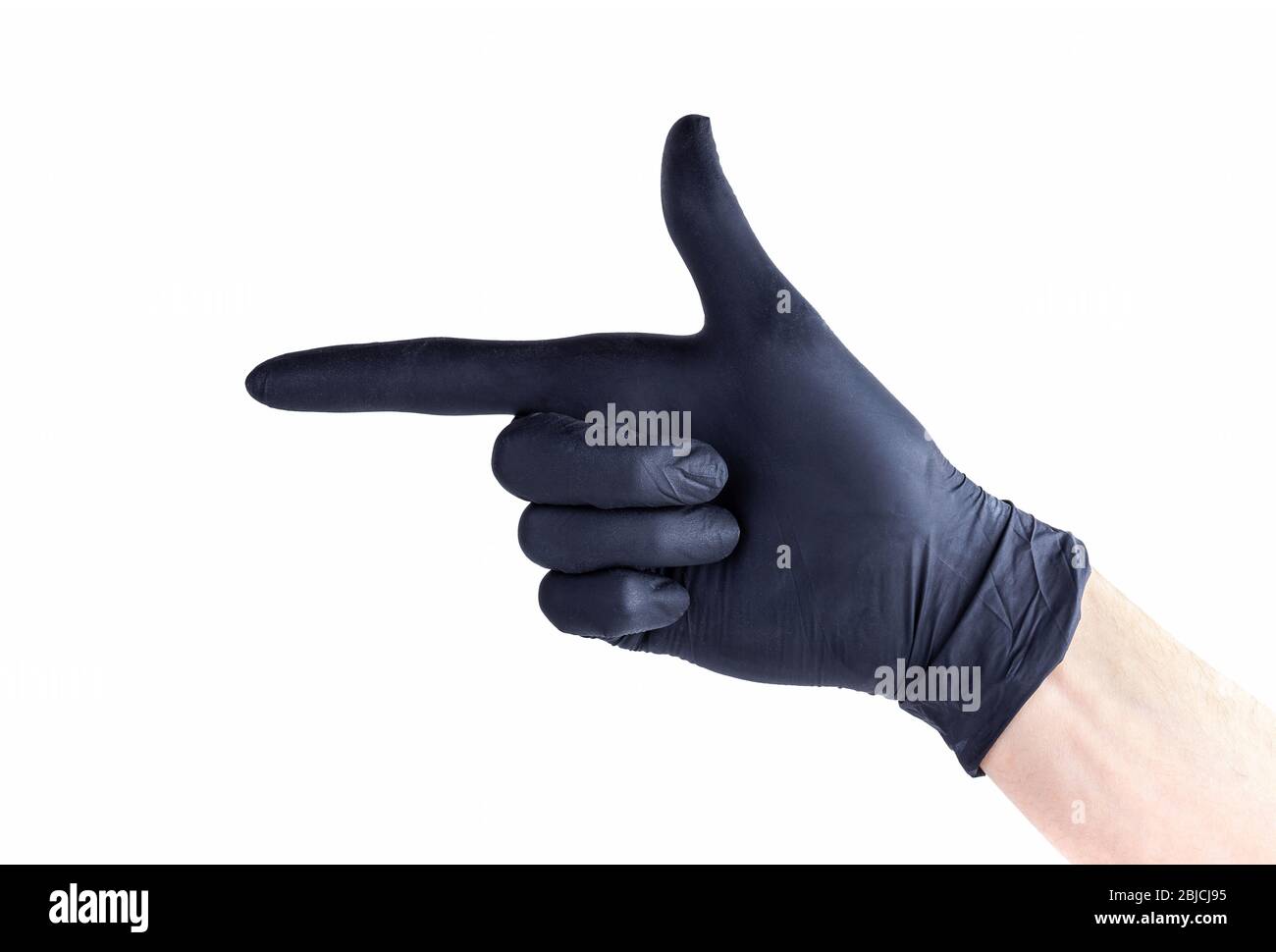 Hand in black protective disposable rubber glove making a finger gun gesture, pointing at something, isolated on white, cut out Stock Photo