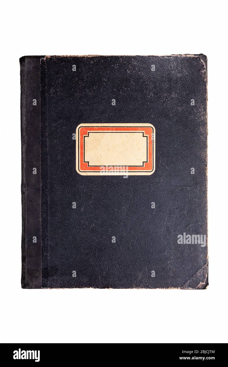 Old vintage worn black book, hardback school notebook cover with an empty blank label, name sticker weathered antique object isolated on white cut out Stock Photo