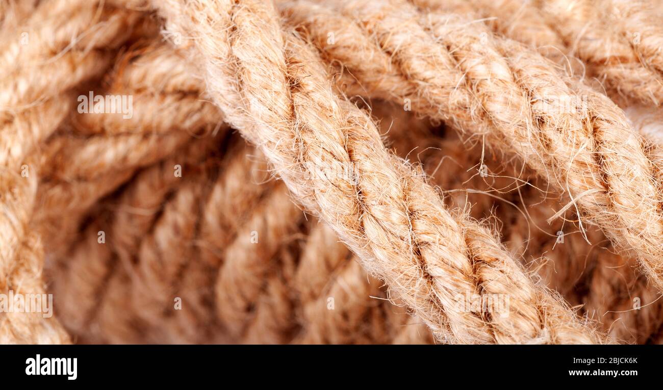 Rope coil macro, closeup, abstract background texture. Tangled tied
