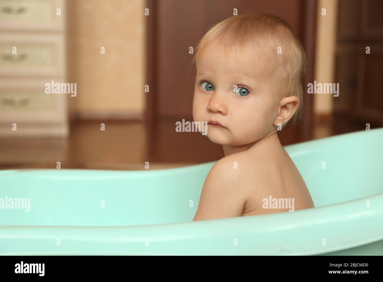 Little baby boy washing in bathtub indoors Stock Photo Alamy