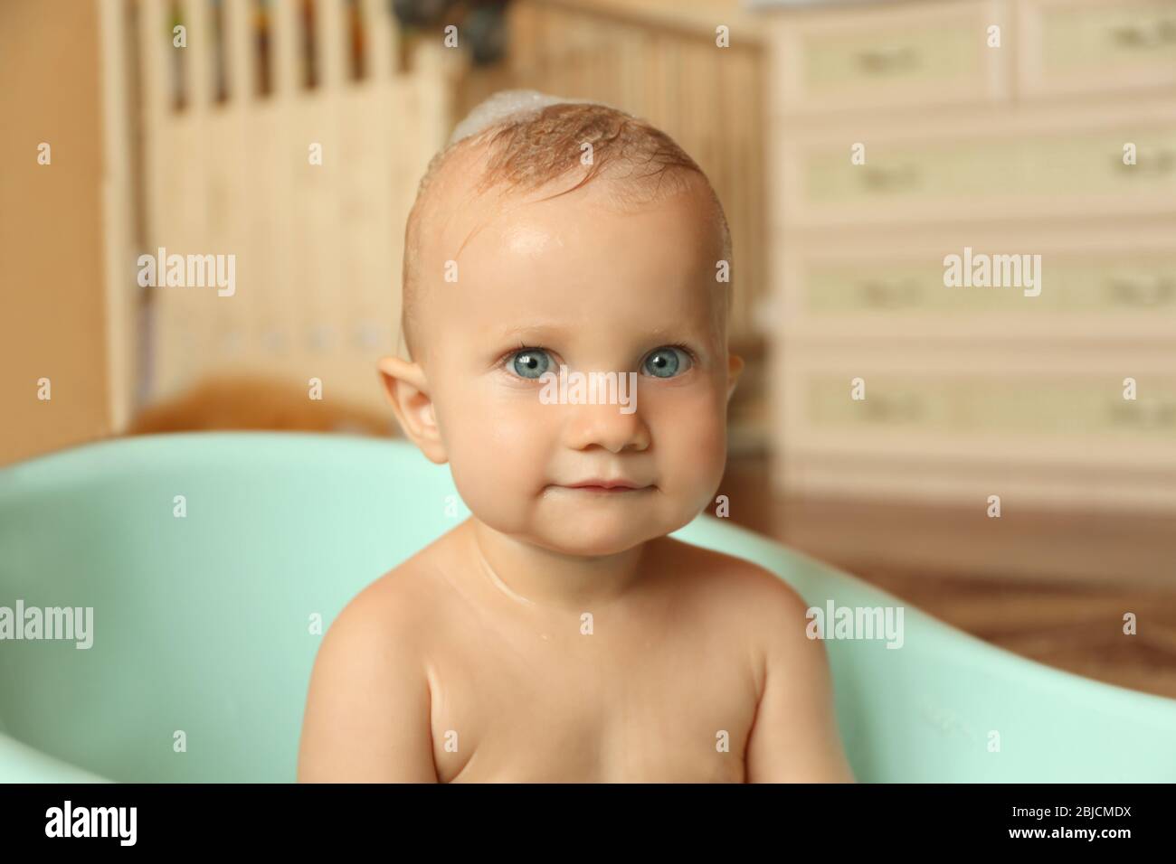 Little baby boy washing in bathtub indoors Stock Photo Alamy
