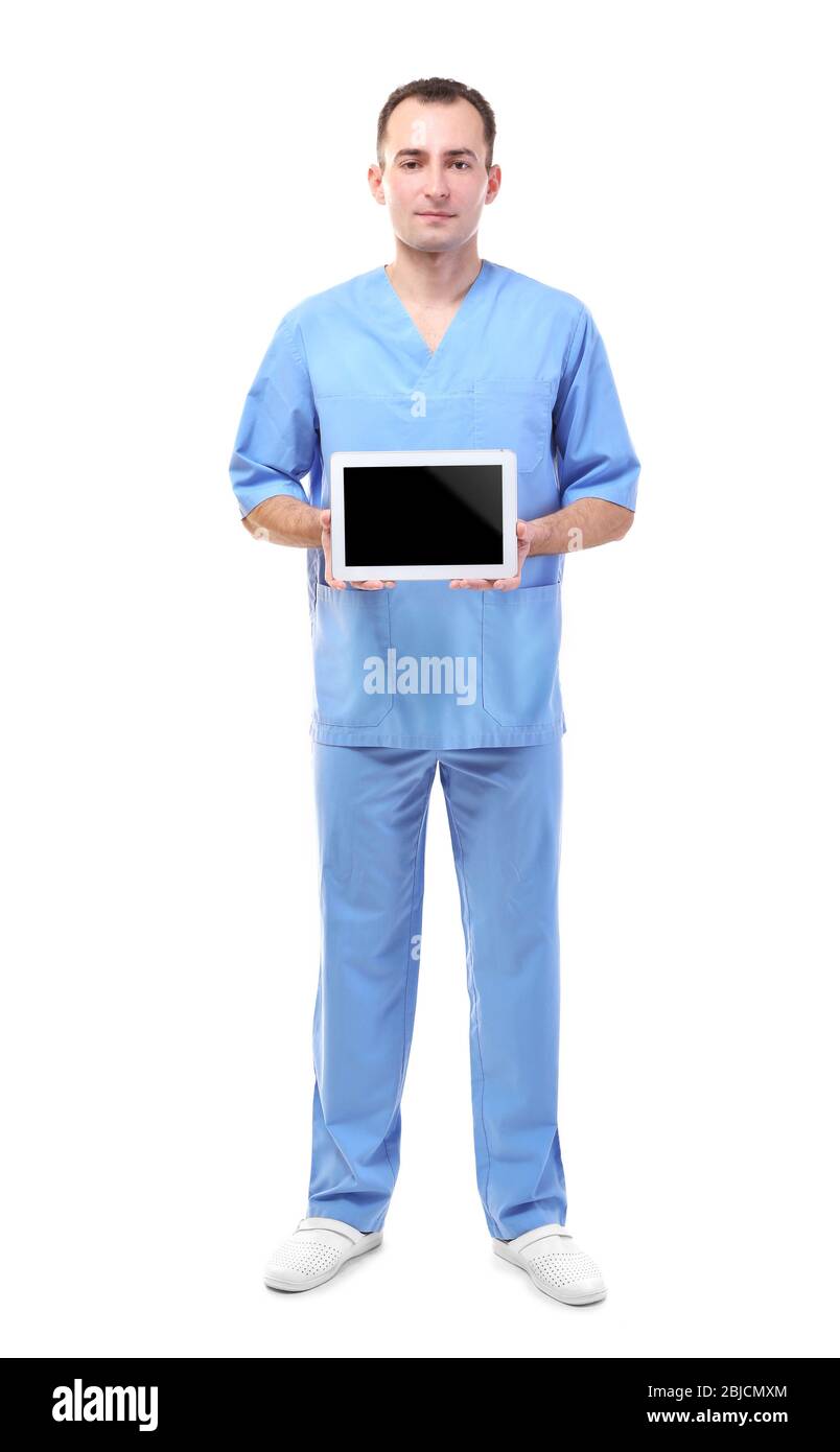 Practitioner in blue uniform holding tablet on white background Stock ...