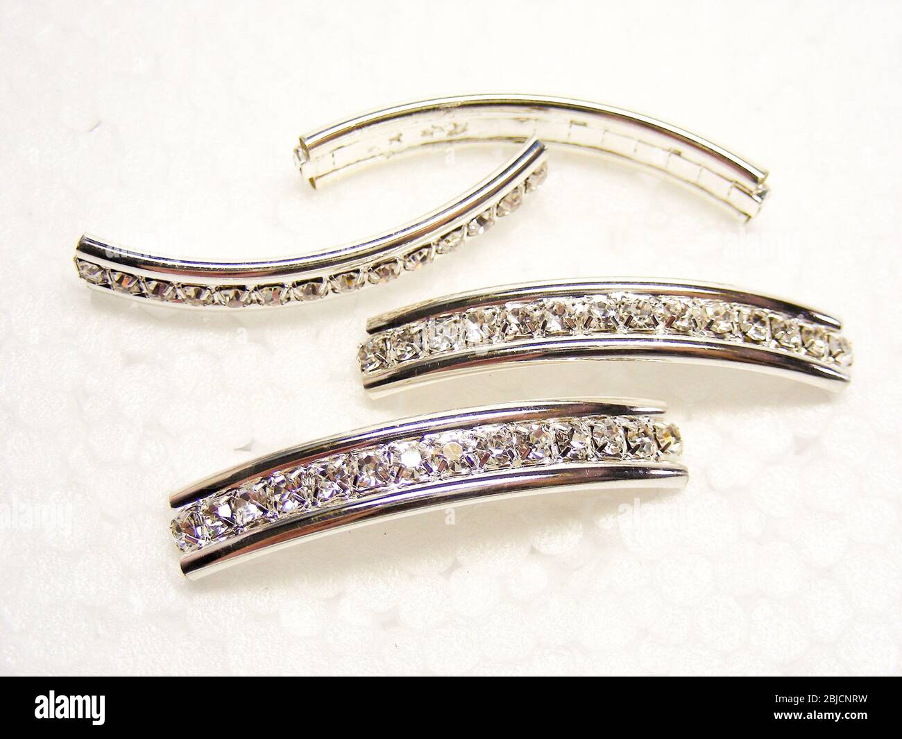 Shiny Rhinestone Shiny sparkling diamond rhinestones on a white background. Fashion gems ...