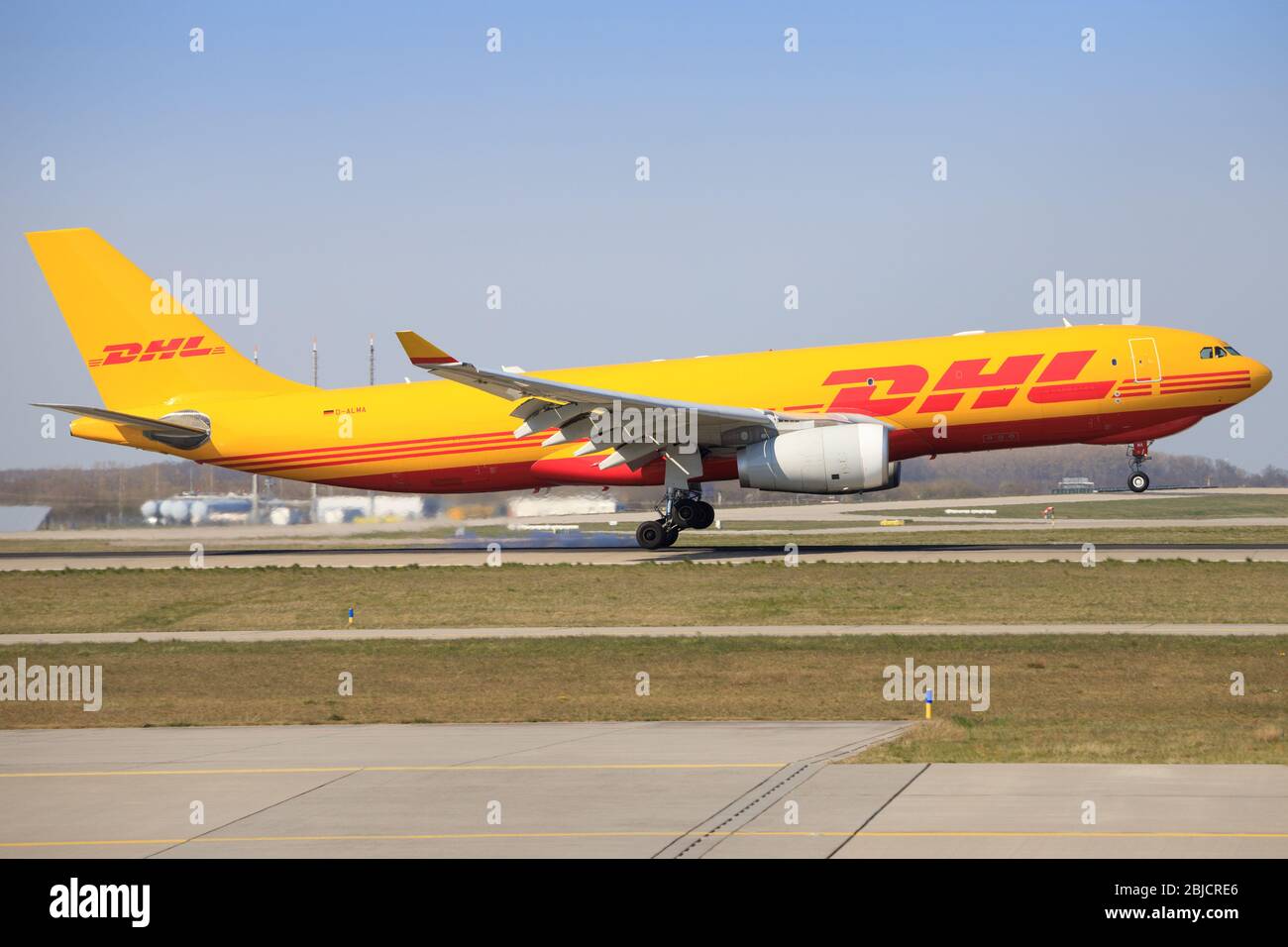 Leipzig, Germany – April 7, 2020: DHL airplanes during Coronavirus Corona Virus COVID-19 at Leipzig Airport in Germany Stock Photo