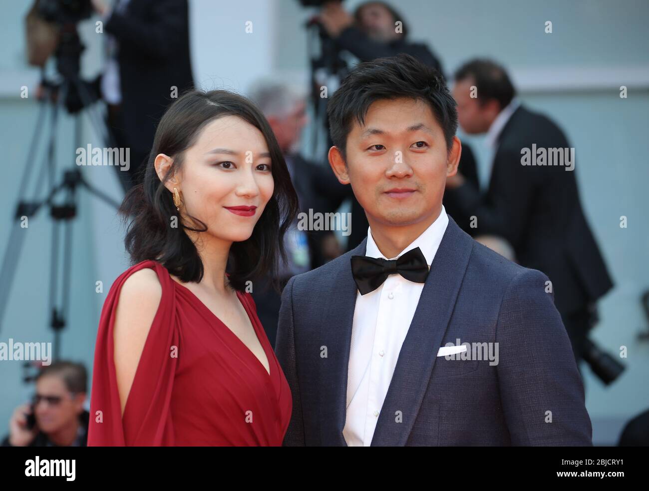 VENICE, ITALY - SEPTEMBER 09: (L-R) Ying Zei and Pengfei walks the red carpet ahead the Award Ceremony of the 74th Venice Film Festival Stock Photo