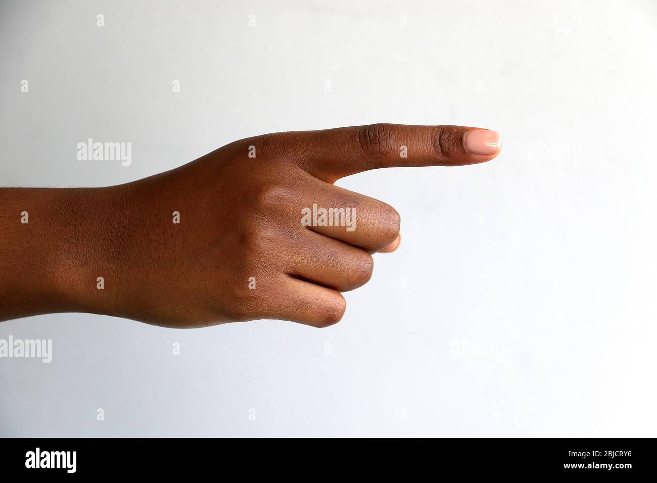 isolated black african indian female hand pointing or counting Stock Photo