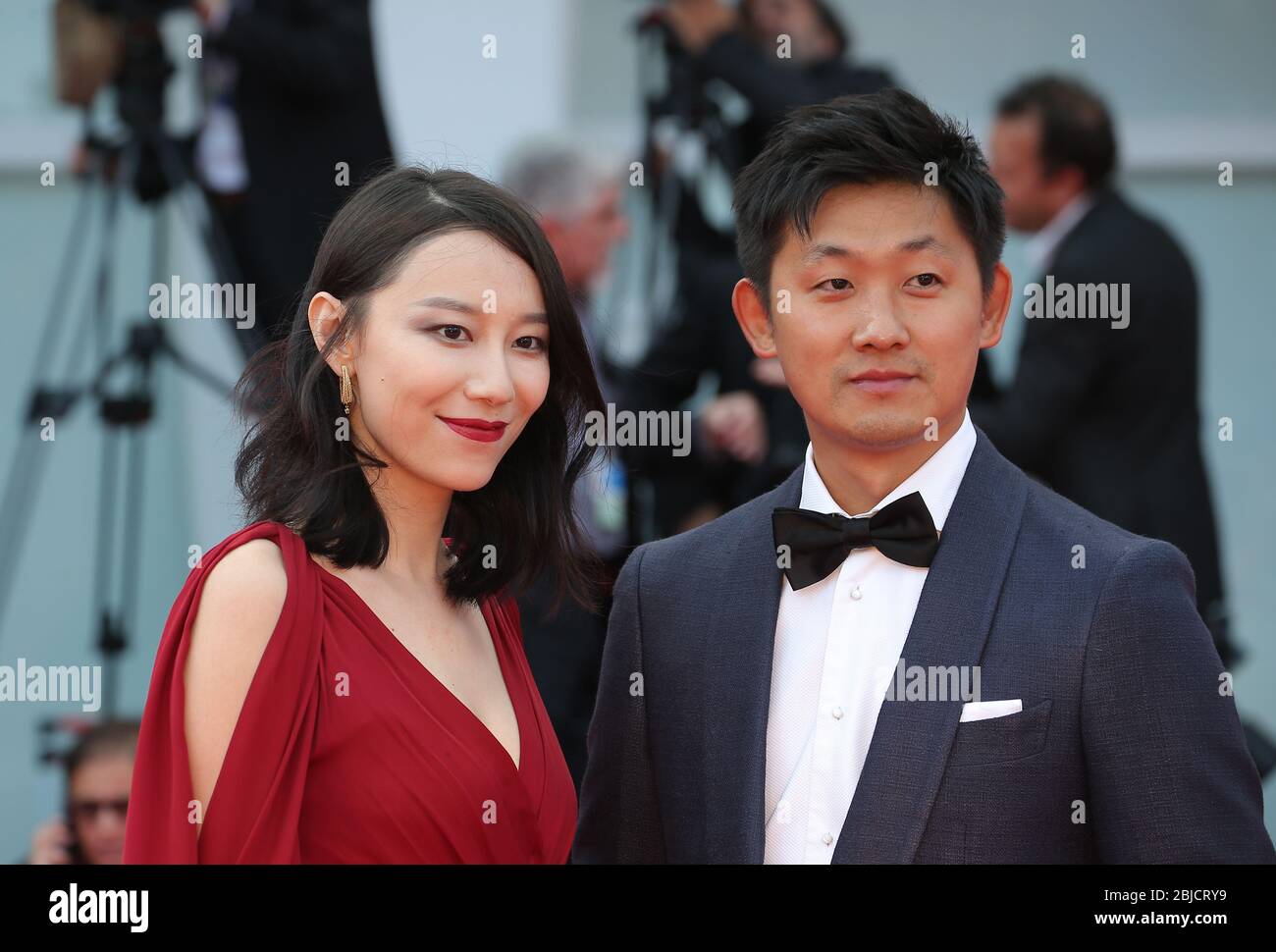 VENICE, ITALY - SEPTEMBER 09: (L-R) Ying Zei and Pengfei walks the red carpet ahead the Award Ceremony of the 74th Venice Film Festival Stock Photo