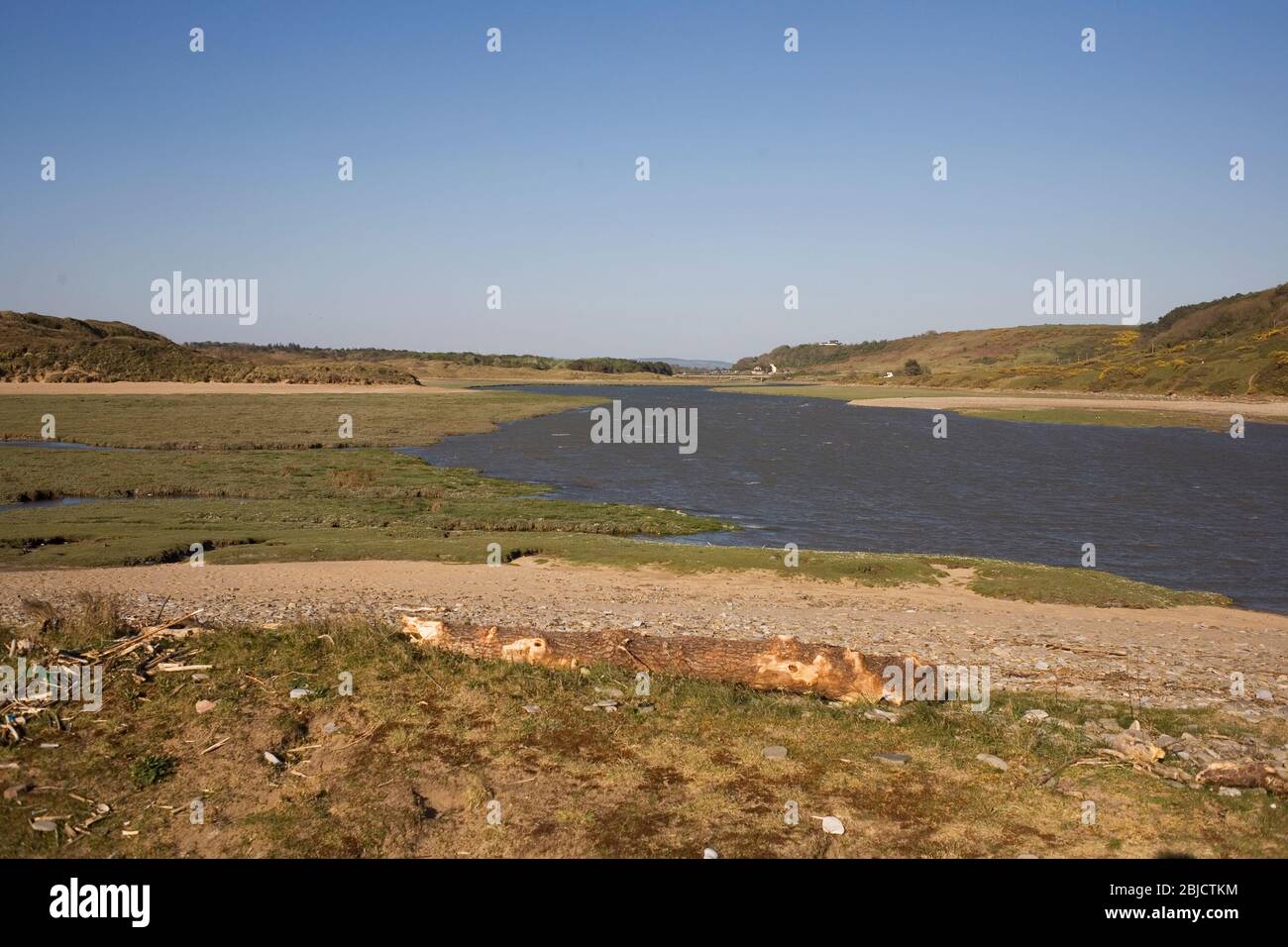 Looking up the Ogmore river from its mouth on a sunny spring afternoon, the sky being being exceptionally clear during the 2020 pandemic lockdown Stock Photo