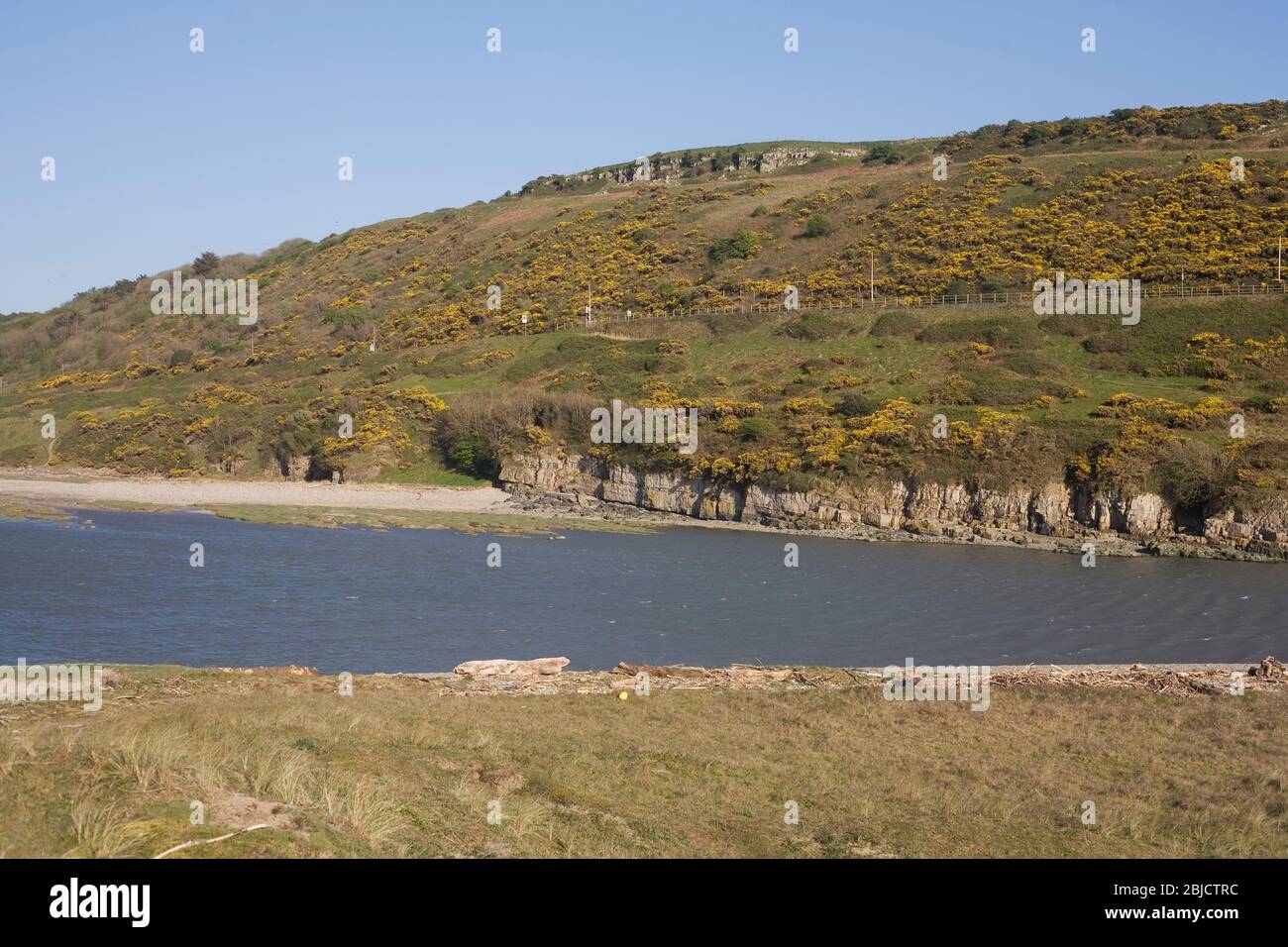 view across the Ogmore river at its mouth on a clear spring afternoon Stock Photo