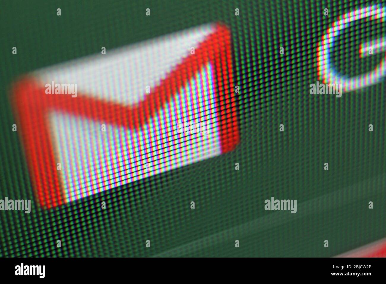 Google gmail envelope icon on screen, close-up Stock Photo